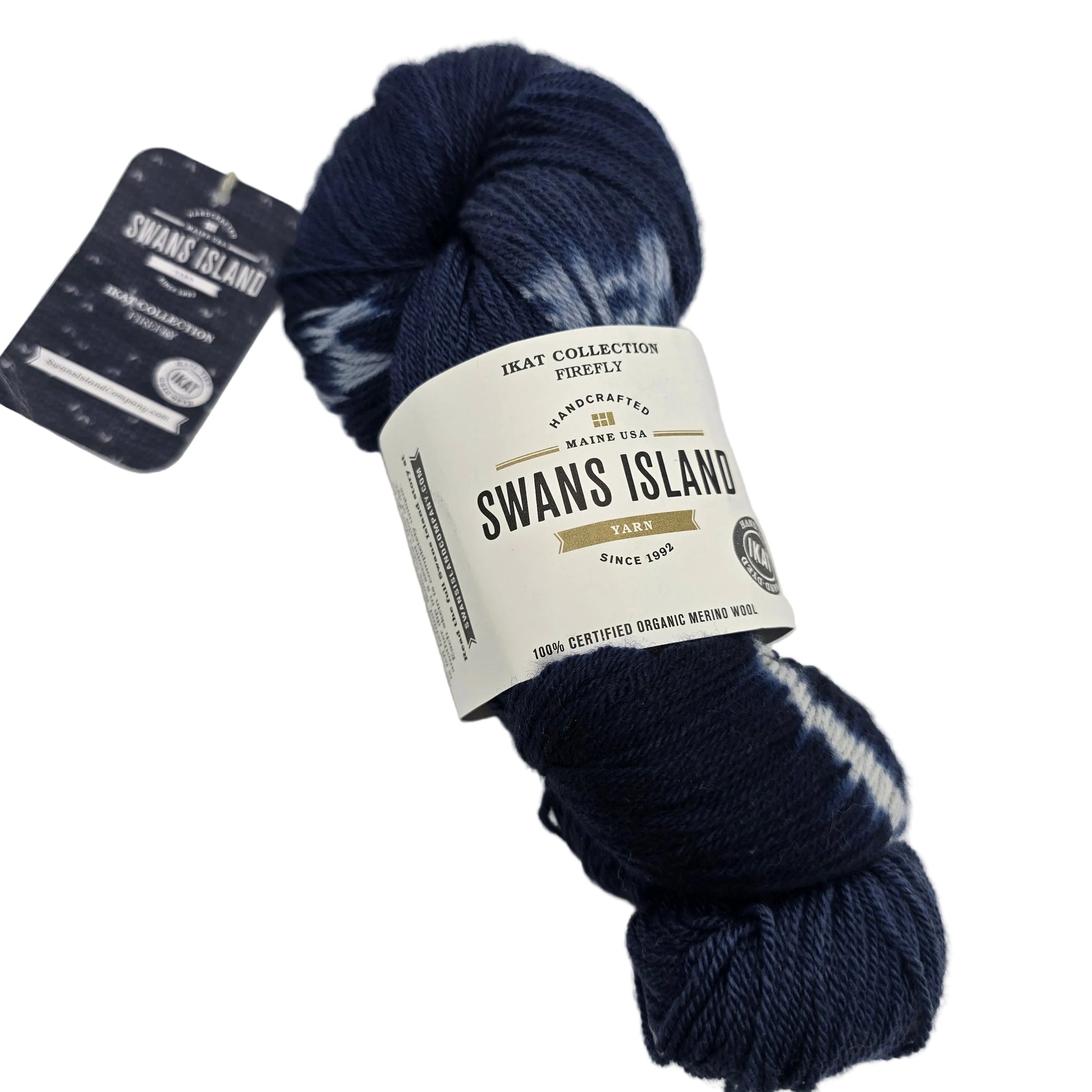 Image of one skein of Ikat Collection Firefly by Swans Island in the color Firefly Sapphire IFF201 with label on a white background.