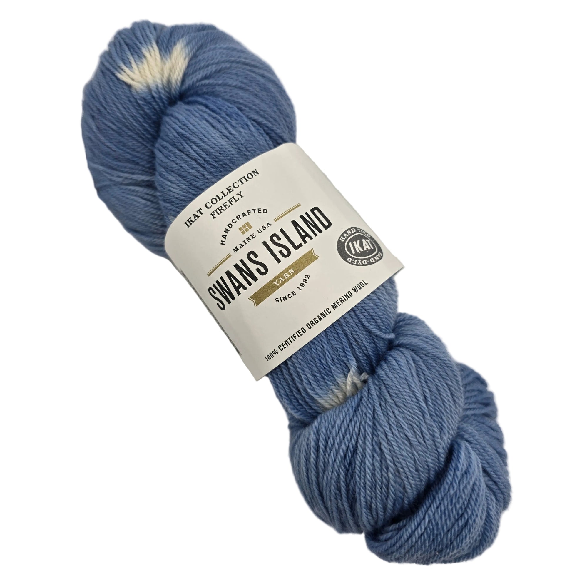 Image of a single skein of Ikat Collection Firefly Yarn by Swans Island in the color Firefly Twilight IFF203 with label on a white background.