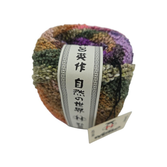 Multicolored skein of Kanzashi by Noro yarn with a label on a white background