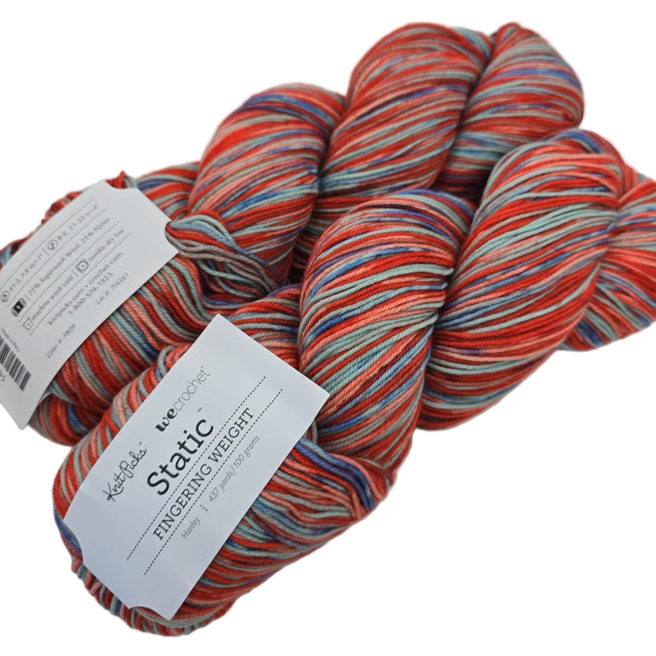 Image of two skeins of yarn by the brand Knit Picks, type Static, in the color  Hanley (which is a multicolor featuring red, blue, green, and orange) with label on a white background.