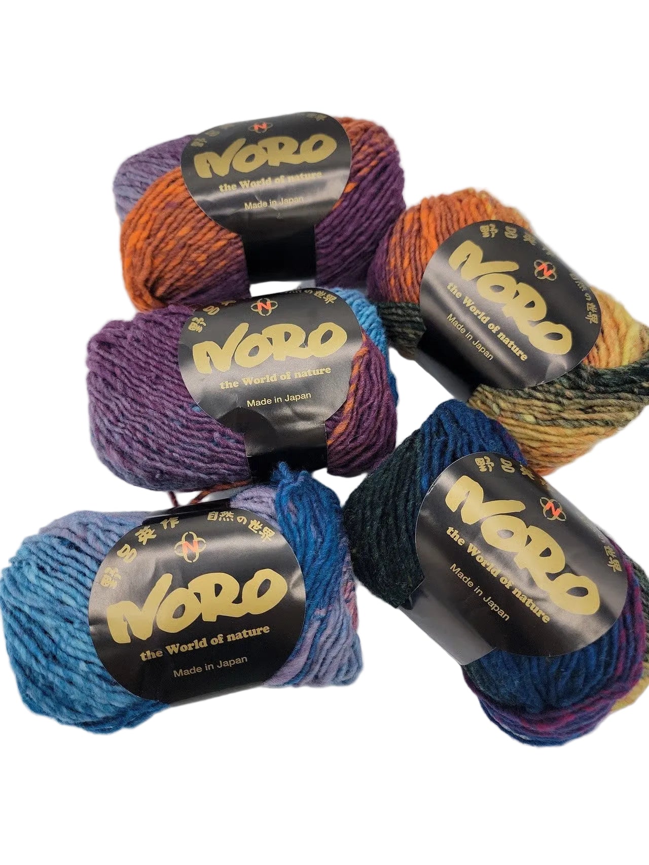 Image of five skeins of multicoloy Kureyon arn by Noro in color 170 with lables on a white background.