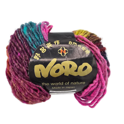 A skein of multi-colored yarn with a black paper label reading 'Noro the world of nature' on a plain white background.