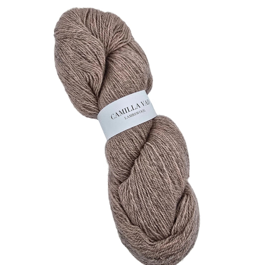 A skein of Lambswool_yarn by_Camilla_Vad in color 9S_Rosa, a light dusty pink with label on a white background.