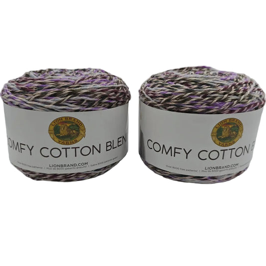 Image of two cakes of Lion Brand Comfy Cotton Blend yarn in the color Blueberry Muffin with labels on a white background.
