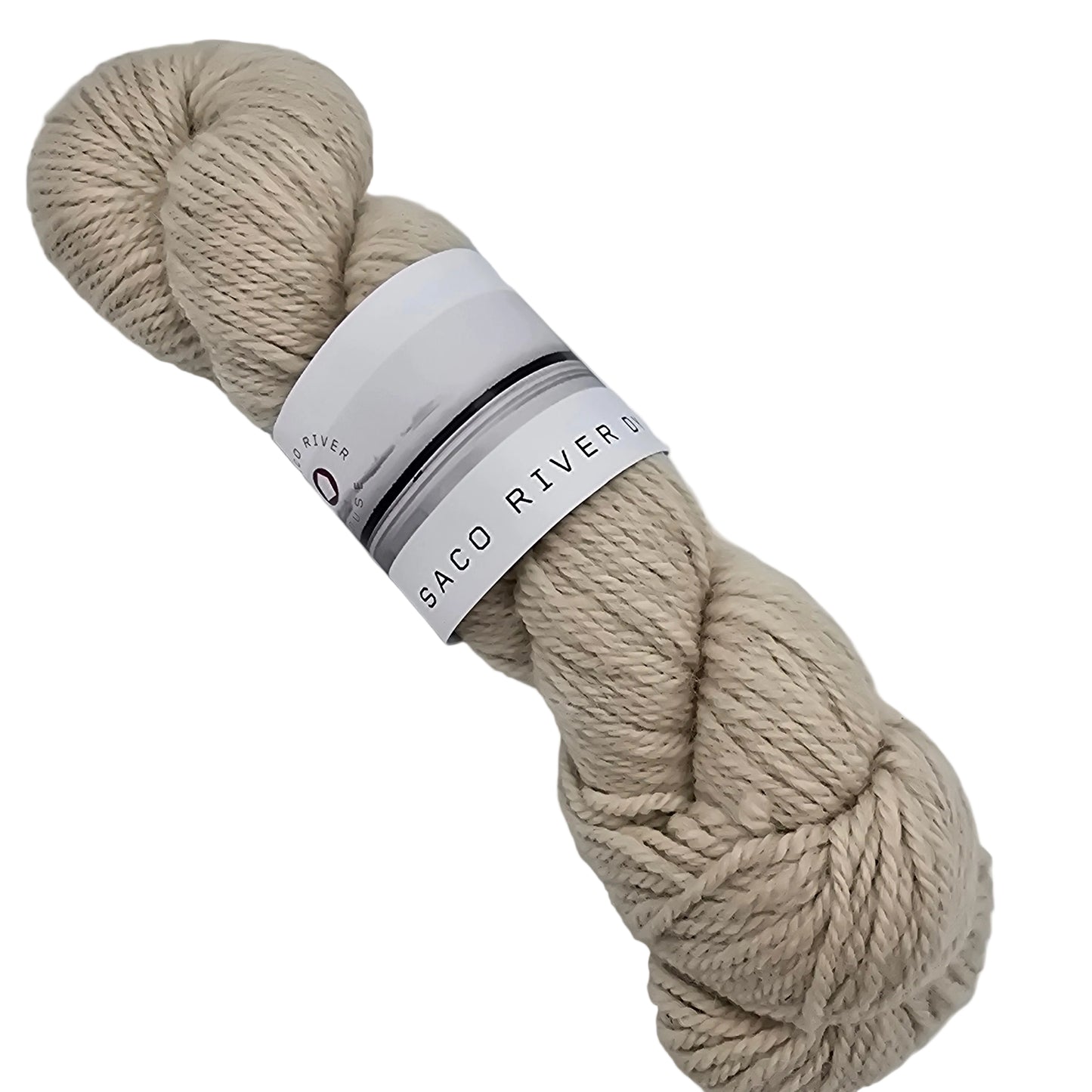 Image of single skein of Lopi Yarn by Saco River Dyehouse  in Beige with label on a white background.