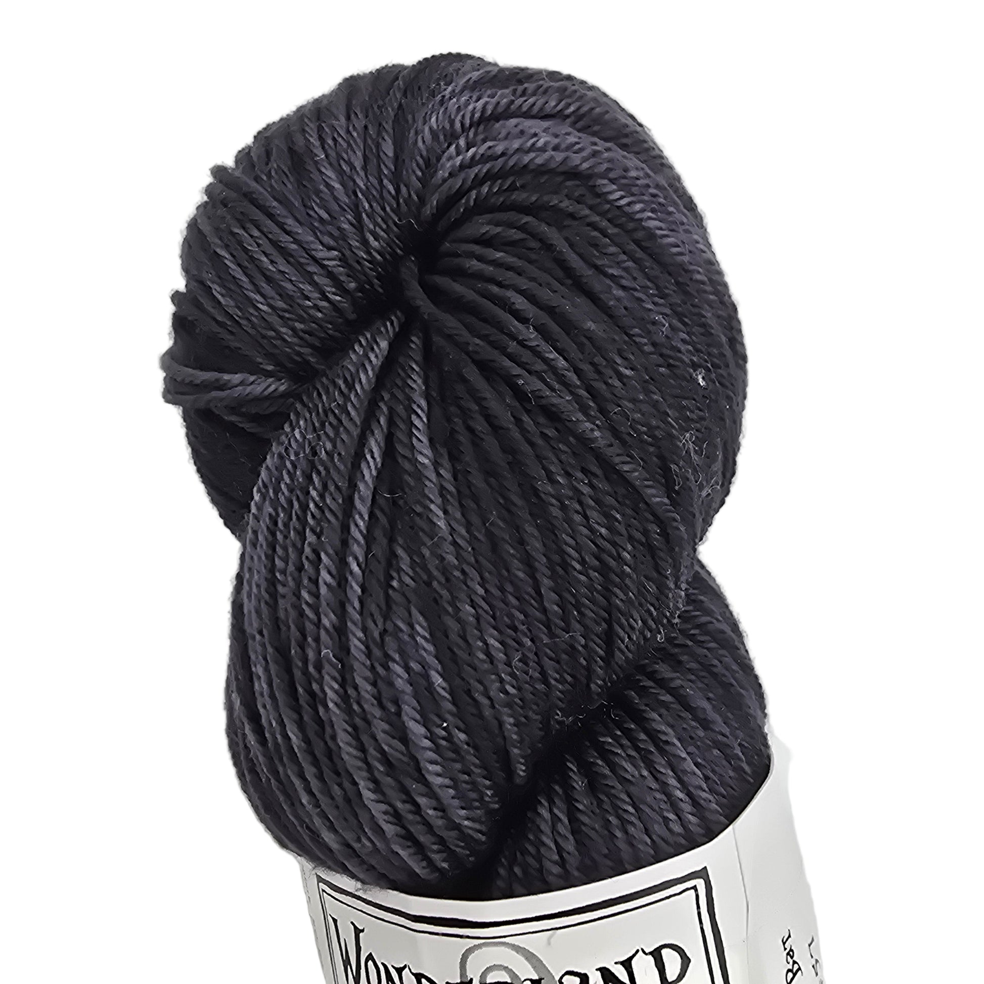 Dark gray skein of yarn with a label on a white background