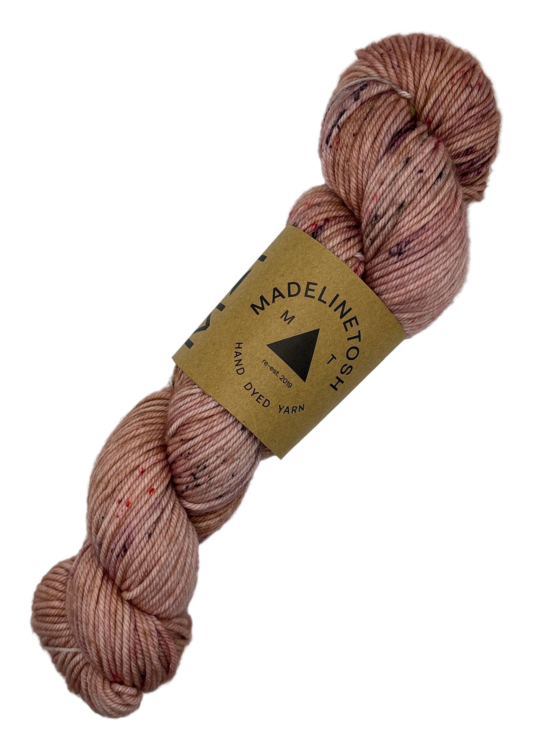 Skein of pink yarn with a Madelinetosh label on a white background