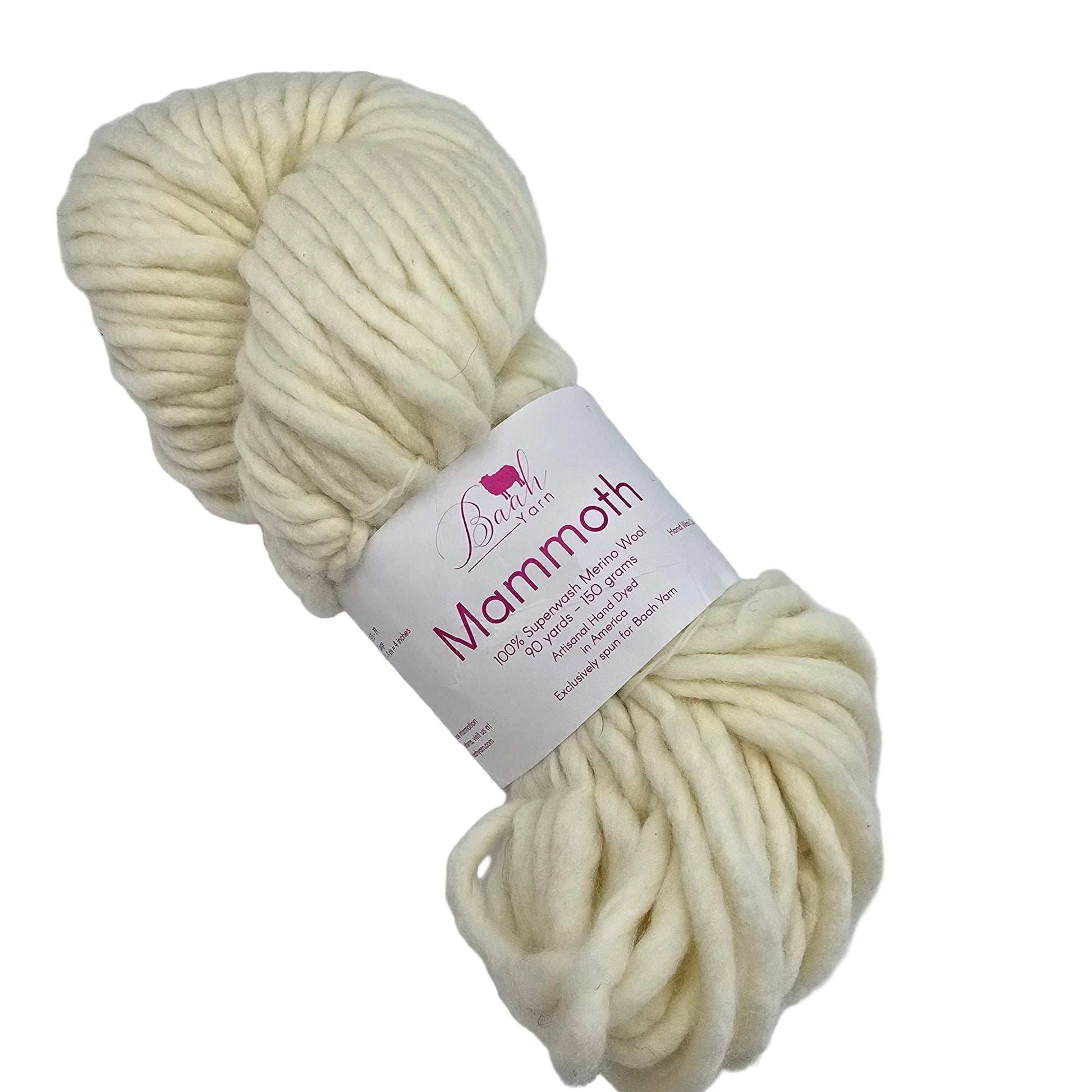 A skein of thick, chunky cream-colored Mammoth Yarn by Baah yarn with a white paper label wrapped around it, photographed on a plain light background.