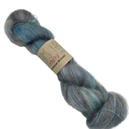 Marvelous Mohair by Emma's Yarn is a luxurious lace-weight blend. Image of a single skein of Marvelous Mohair yarn by Emma's Yarn in the color Chasing Waterfalls with label on a white background.