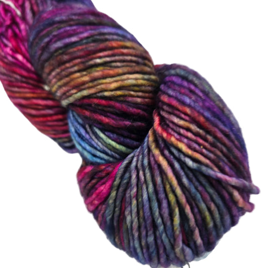 Close-up Image of single hank of Mecha Yarn by Malabrigo in color 005 Aniversario on a white background.