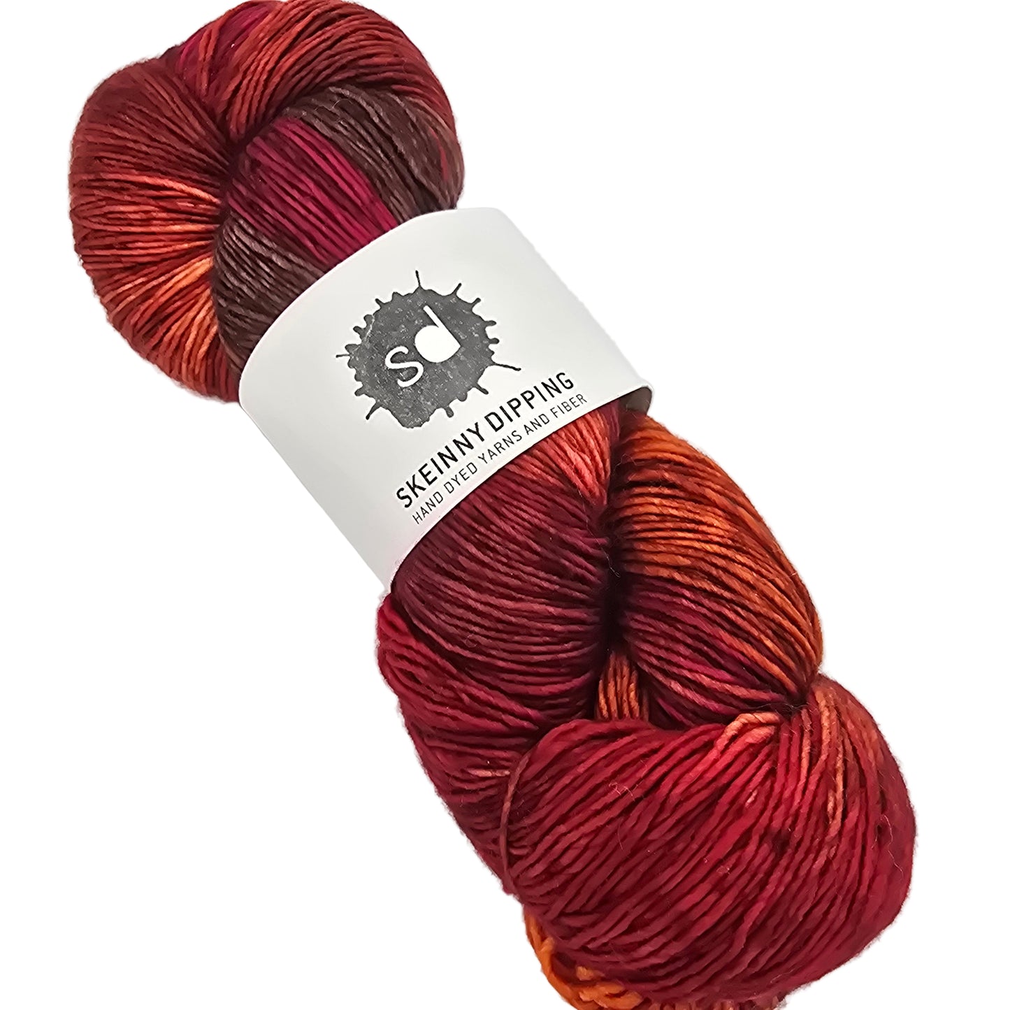 Red and brown skein of yarn with a label on a white background