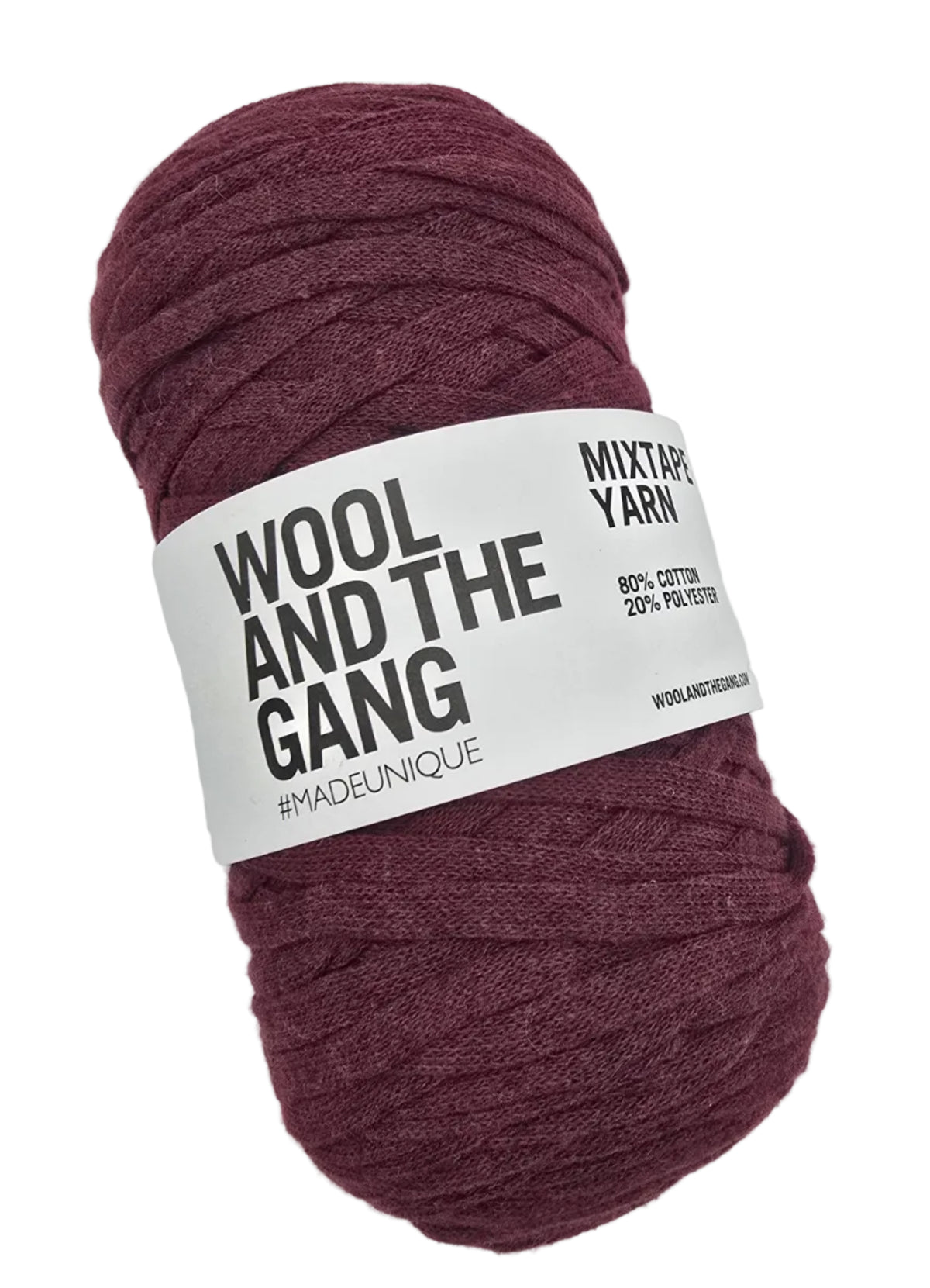 Image of a single skein of Mixtape_Yarn_by_Wool_And_The_Gang_in the color_Margaux_Red a medium burgundy with label on a white background.