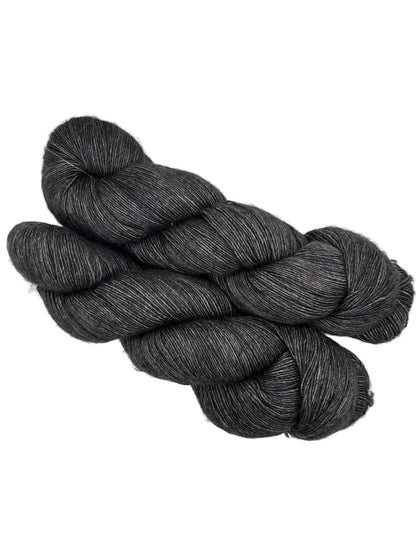 Two Skeins of Monologue by Leading Men Fiber Arts Yarn in the color Don’t Fear the Reaper on a white background.