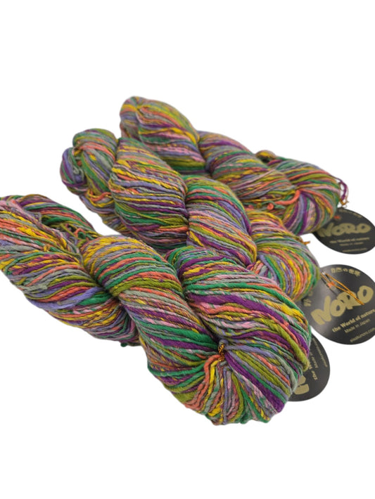 Multicolored yarn skeins with Noro labels on a white background