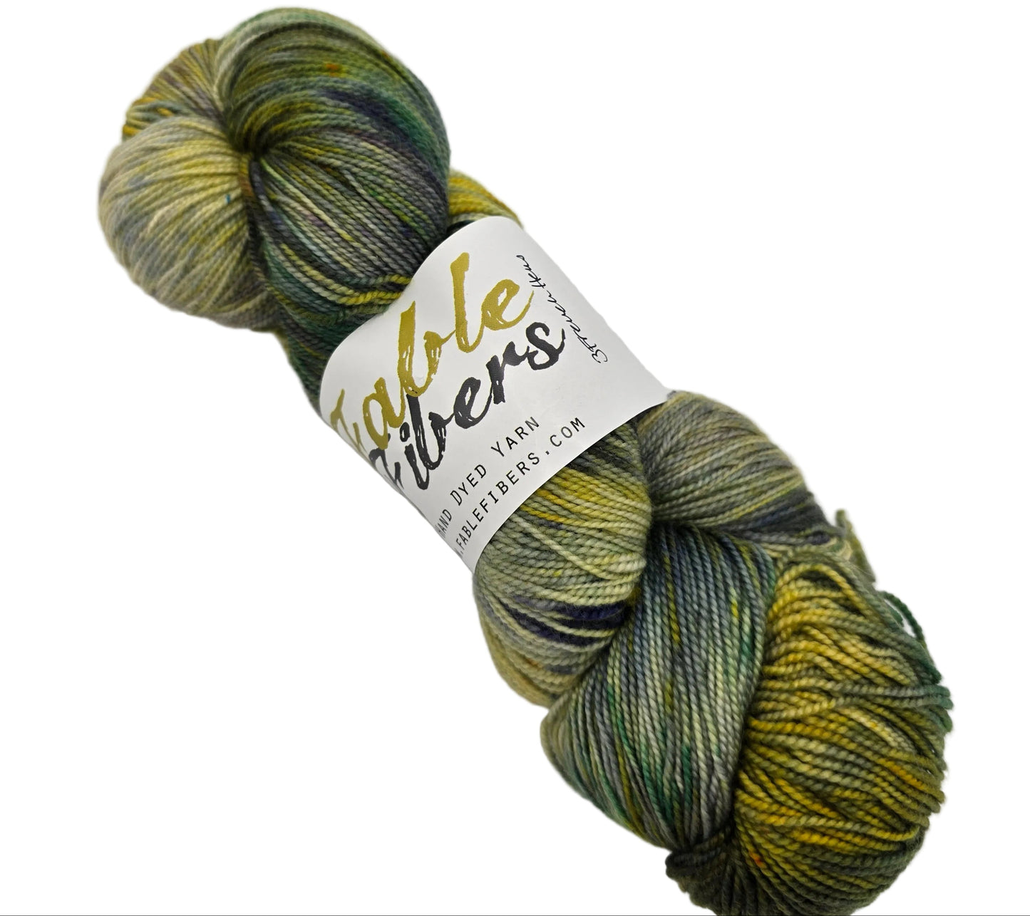 Image of a single skein of NovelYarn by Fable Fibers in the color 3 French Hens with label on a white background.