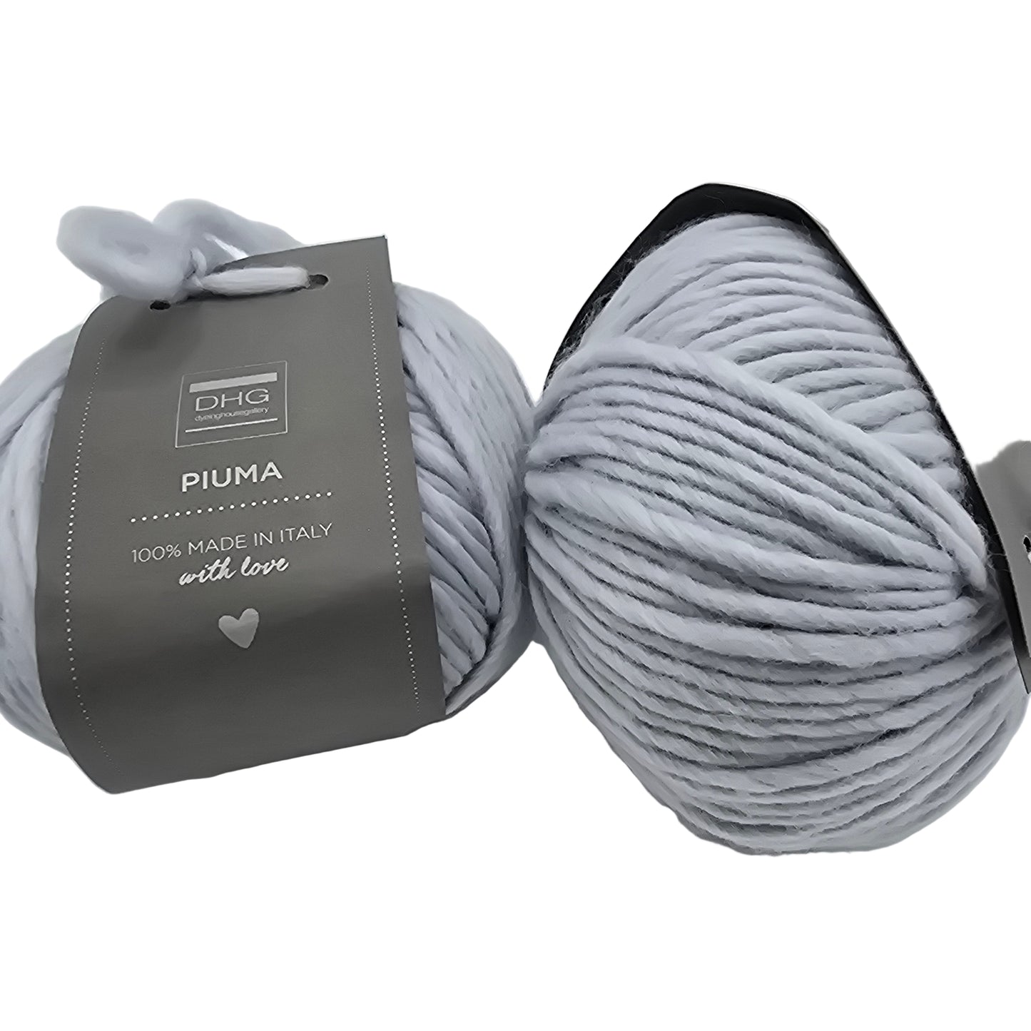 Image of two balls of Piuma by DHG Ultra Soft bulky Italian Merino Wool  yarn in the color cloud which is a solid pale bluish grey with labels on a white background