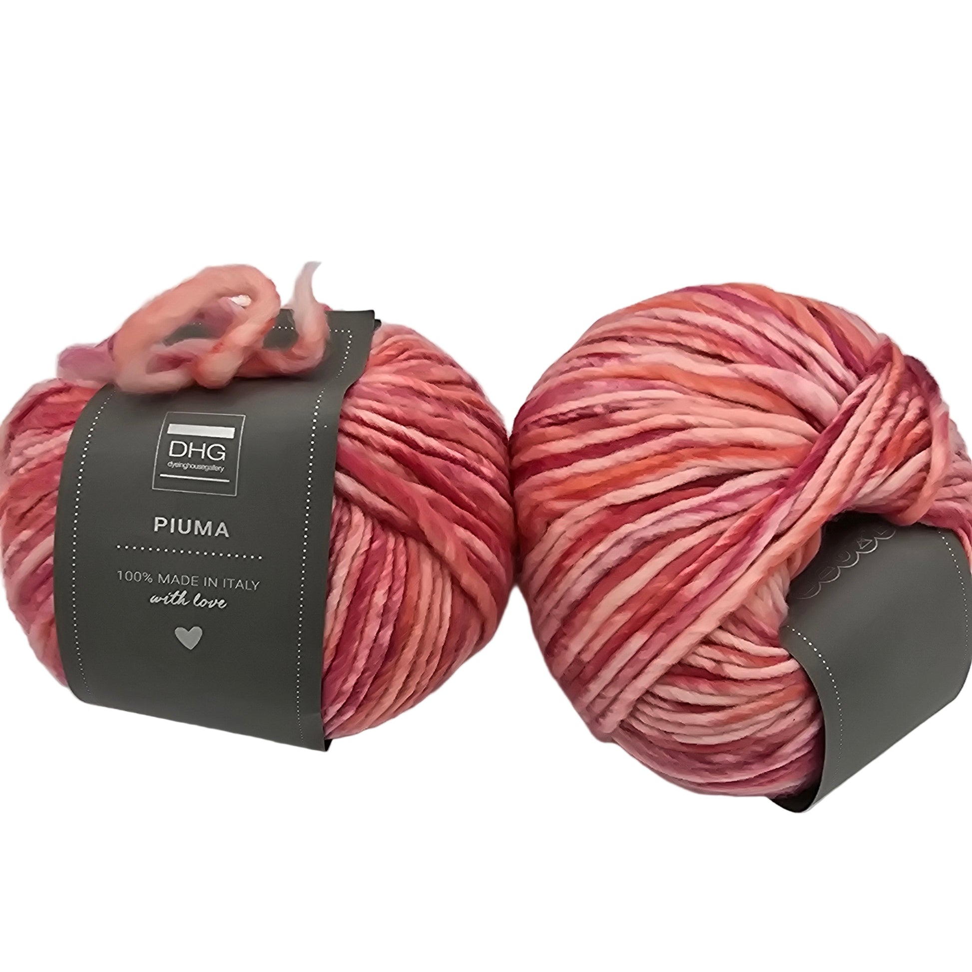 Image of two balls of Piuma by DHG Ultra Soft, bulky, Italian, Merino Wool  yarn in the color Fairytale which is a multicolor yarn with mixed pinks, oranges and reds with labels on a white background.