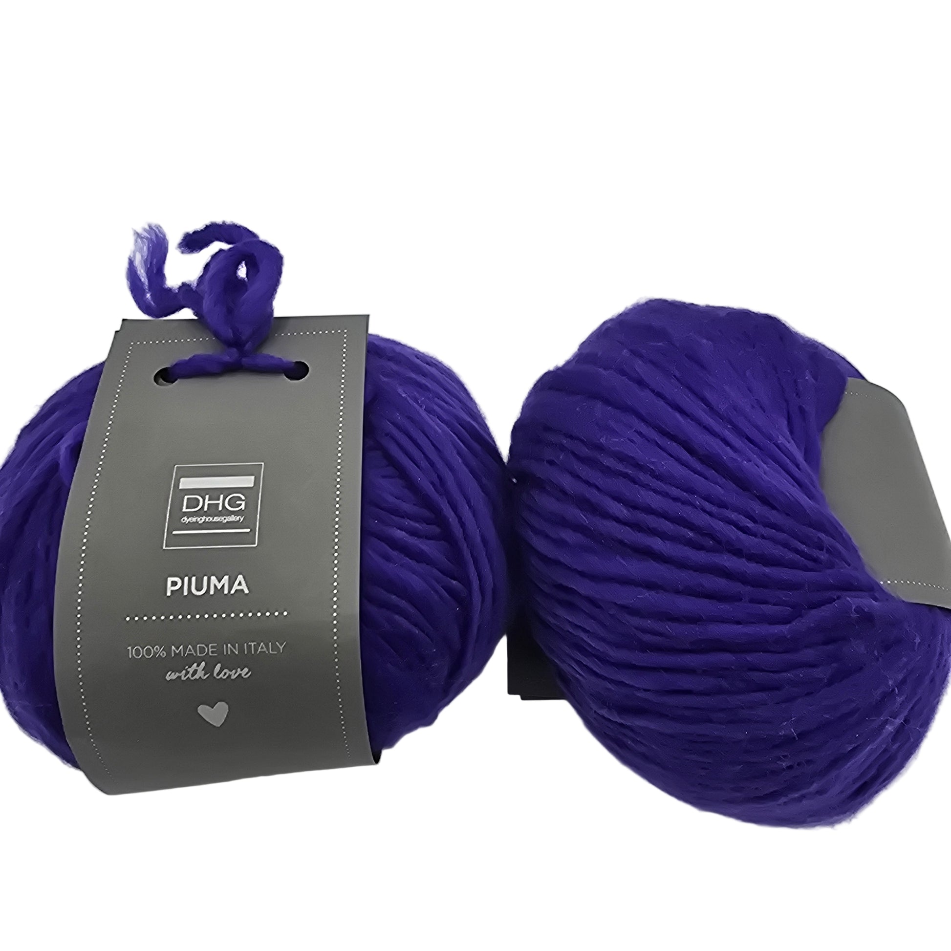 Image of two balls of Piuma by DHG Ultra Soft bulky Italian Merino Wool  yarn in the color Florence which is a solid vibrant purple with labels on a white background