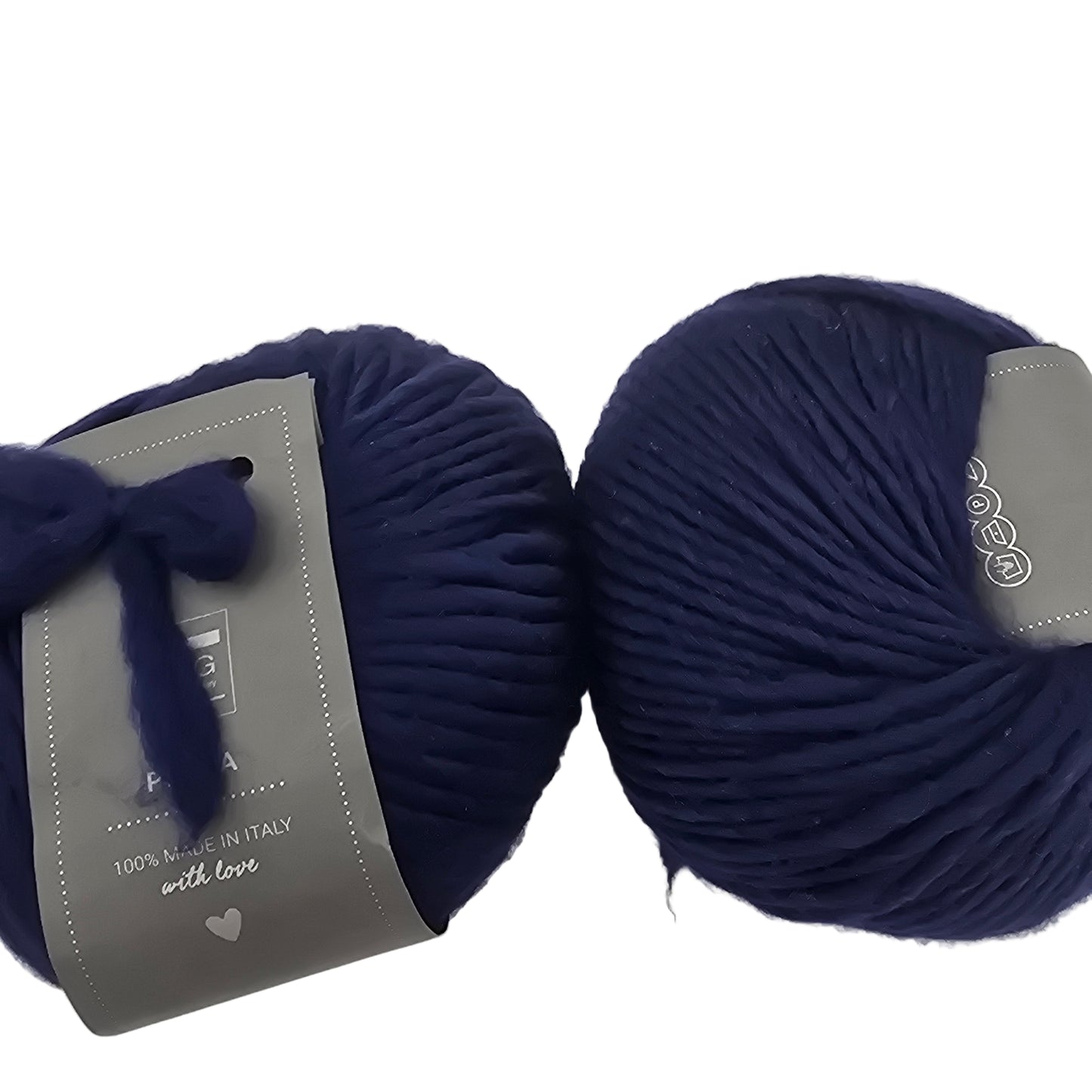 Image of two balls of Piuma by DHG Ultra Soft bulky Italian Merino Wool  yarn in the color Taureg which is a solid dark blue with labels on a white background