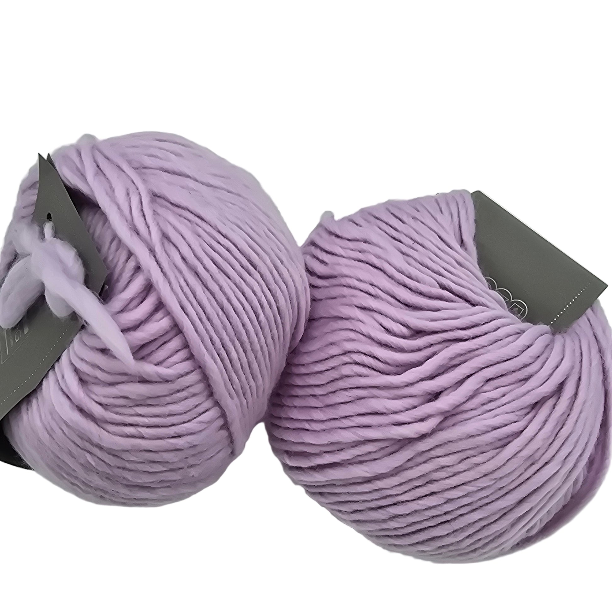 Image of two balls of Piuma by DHG Ultra Soft bulky Italian Merino Wool  yarn in the color twilgiht which is a solid lavender with labels on a white background.