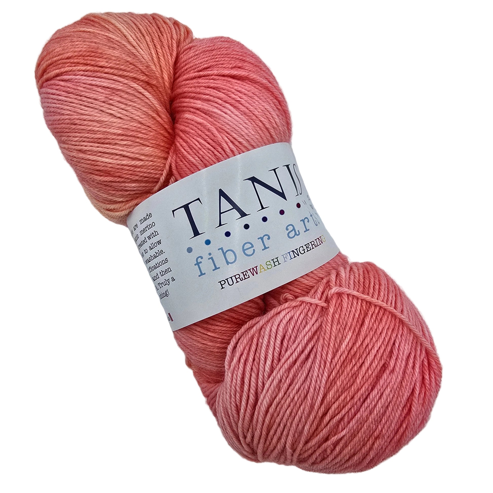 Image of a single skein of Purewash_Fingering_Yarn_by_Tanis_in the color_Pink Grapefruit with label on a white background.