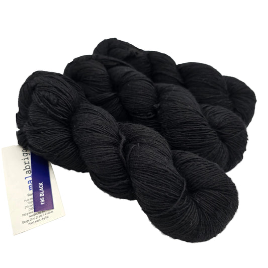 Image of 3 skeins of Rastita by Malabrigo in 195 Black with tag on a white background.
