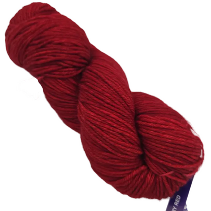 Image of a single hank of Rios by Malabrigo yarn in color 611 Ravelry Red with label on a white background.