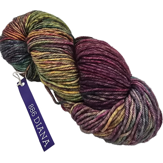 Image of a single skein of Rios by Malabrigo Yarn in the color 886 Diana which is a purple heavy multicolor with label in a white background.