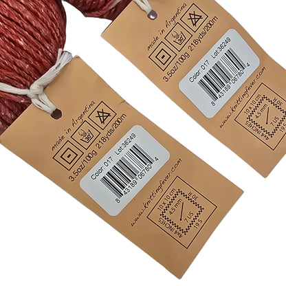 Two brown product tags with barcodes and symbols on a light gray background