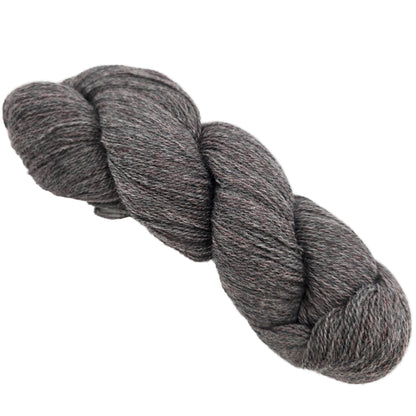 Image of single skein of Shadow Heathered yarn by Knit Picks in the color shadow Basalt on a white background.