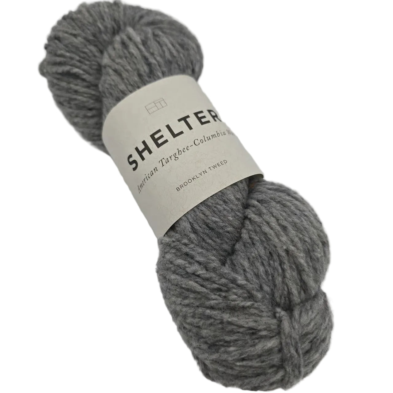 Image of a single hank of Shelter Yarn By Brooklyn Tweed in the color Sweatshirt with label on a white background.