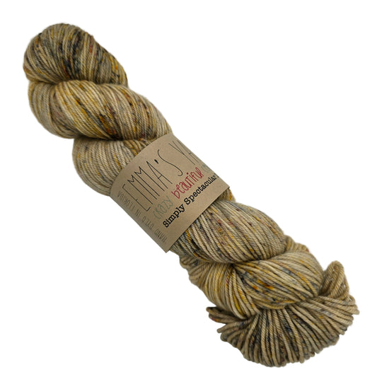 Image of a single skein of Simply Spectacular yarn by Emma's Yarn in Color November '22 with label in a white background.