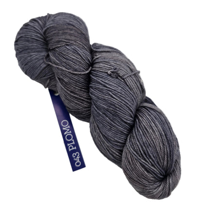 Image of a single skein of Sock yarn by Malabrigo in color 043 Plomo with label on a white background.