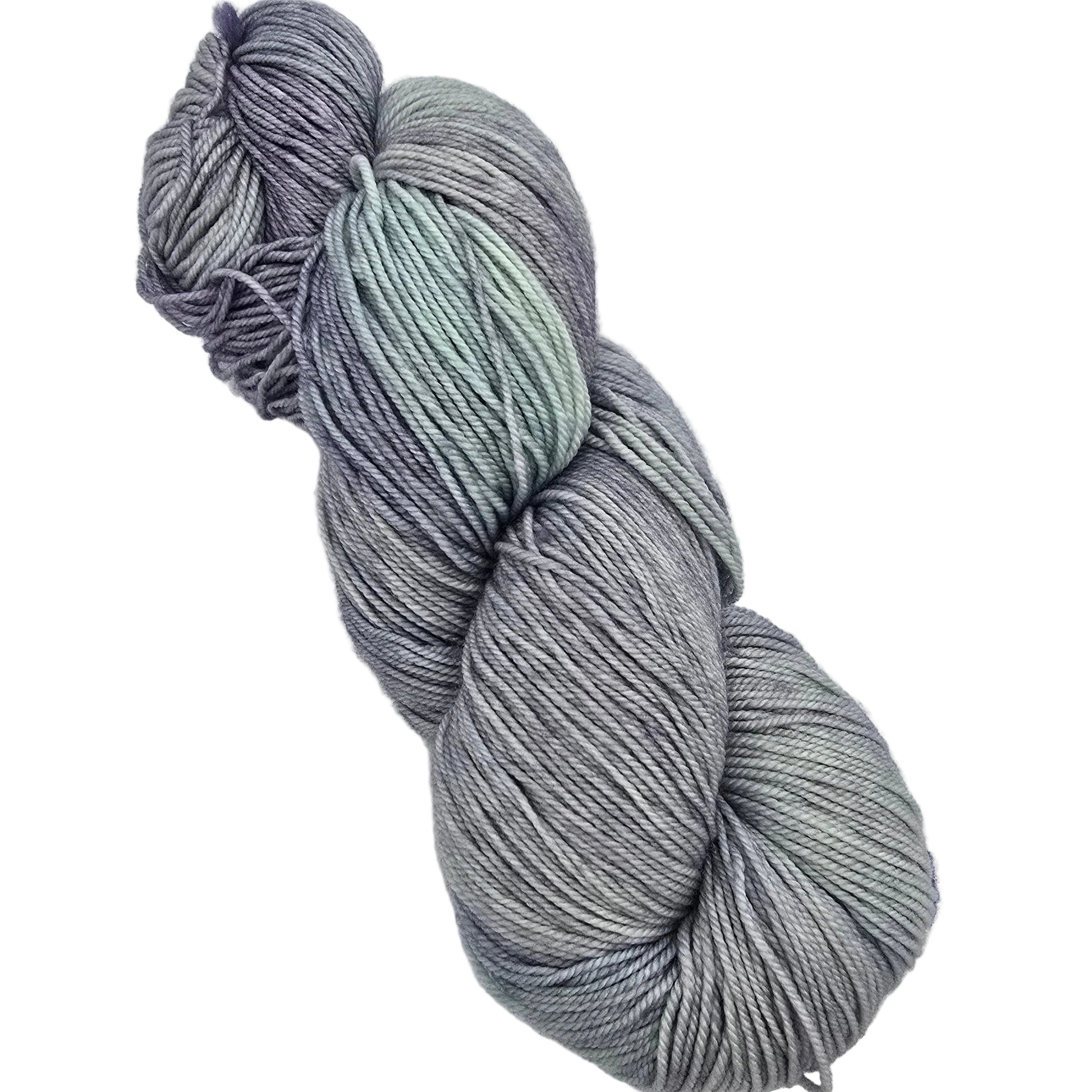 A single twisted skein of variegated yarn in shades of gray, lavender, and pale mint green, with a small product tag partially visible at the lower right on a plain light background.