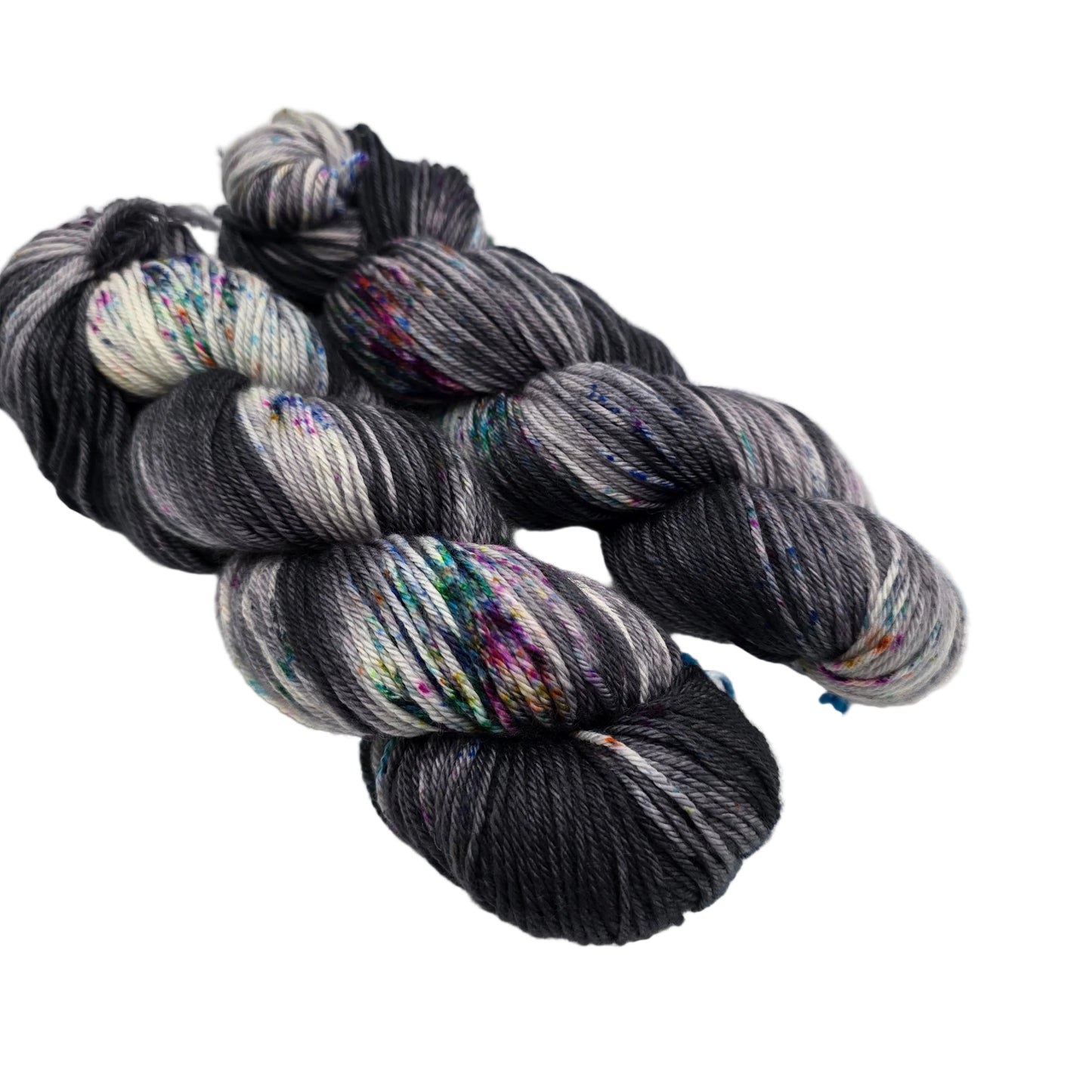 Image of two skeins of Springvale DK Yarn by Three Irish Girls Yarn Inc. in the color Sunday Funnies on a white background.