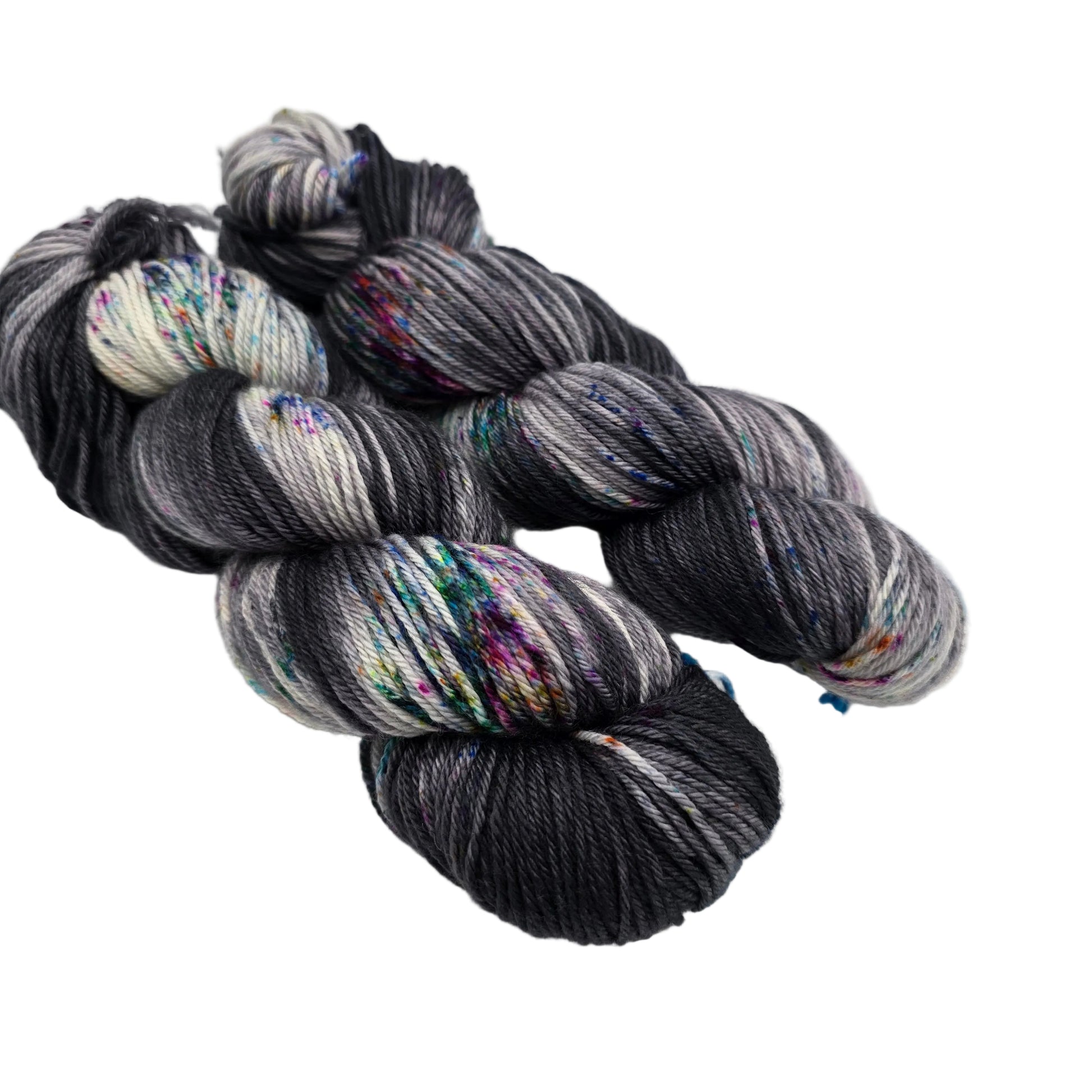 Image of two skeins of Springvale DK Yarn by Three Irish Girls Yarn Inc. in the color Sunday Funnies on a white background.