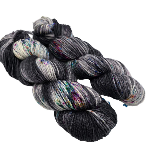 Image of two skeins of Springvale DK Yarn by Three Irish Girls Yarn Inc. in the color Sunday Funnies on a white background.