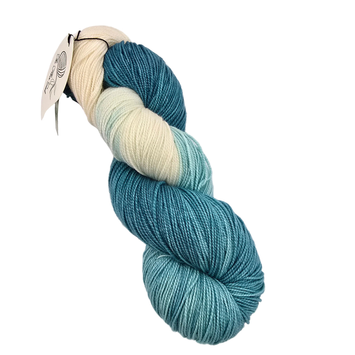 A single skein of variegated yarn with a paper tag, showing a color gradient from cream to teal and aqua, photographed on a white background.