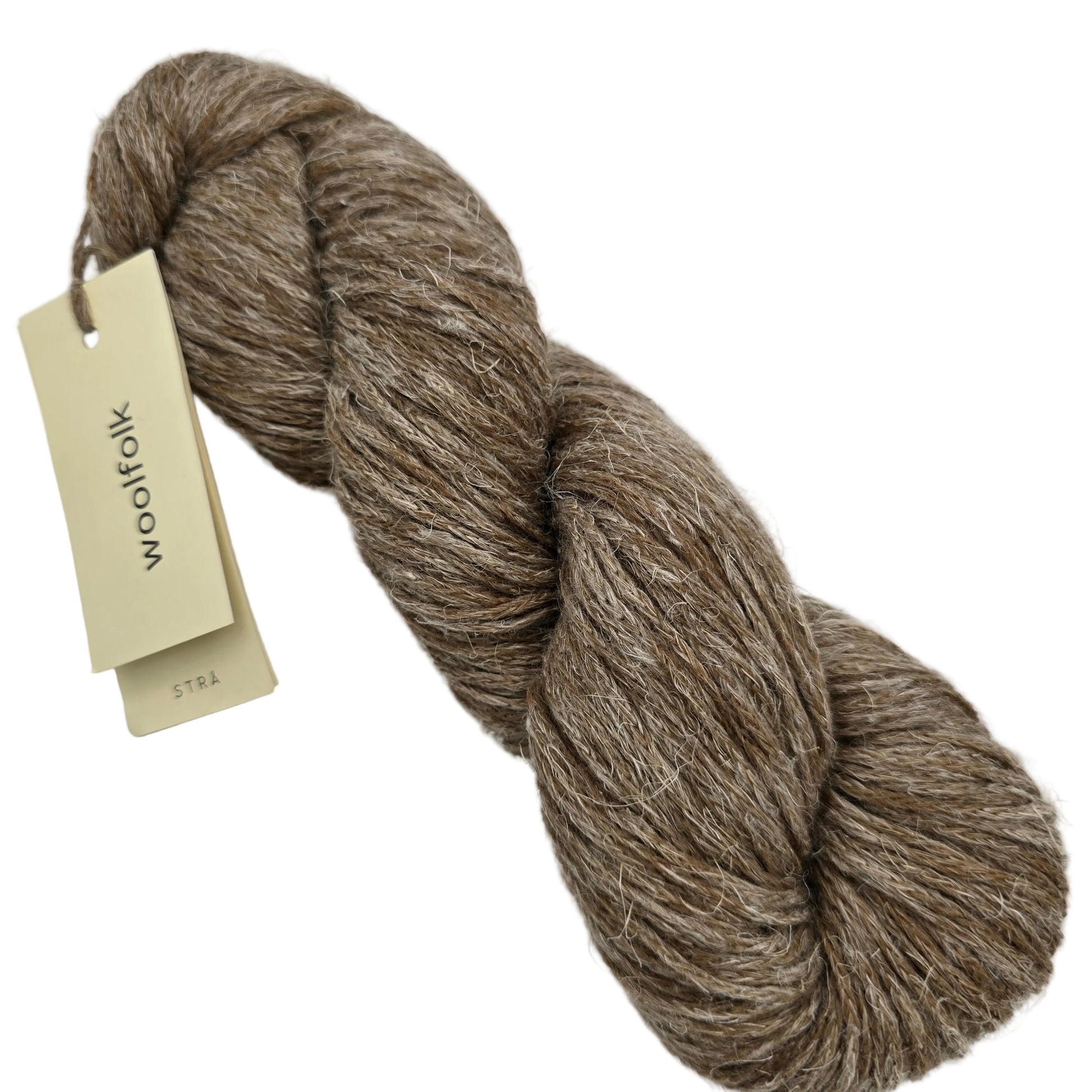 Image of a single skein of Stra by Woolfolk yarn in color S3 with label on a white background.