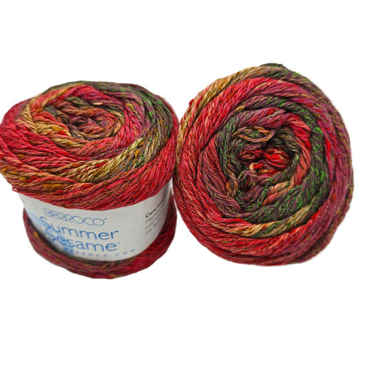 Image of two cakes of Summer Sesame Yarn by Berroco -in Color 5253 with label on white background.