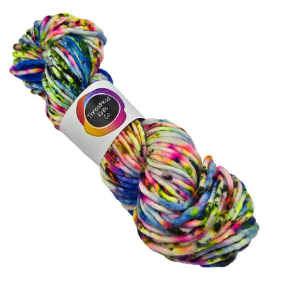 Image of a single skein of Super_Bulky_by_ThreadHead_Knits_Co_-in the color Blue Kamikaze a variegated multicolor yarn with label on a white background.