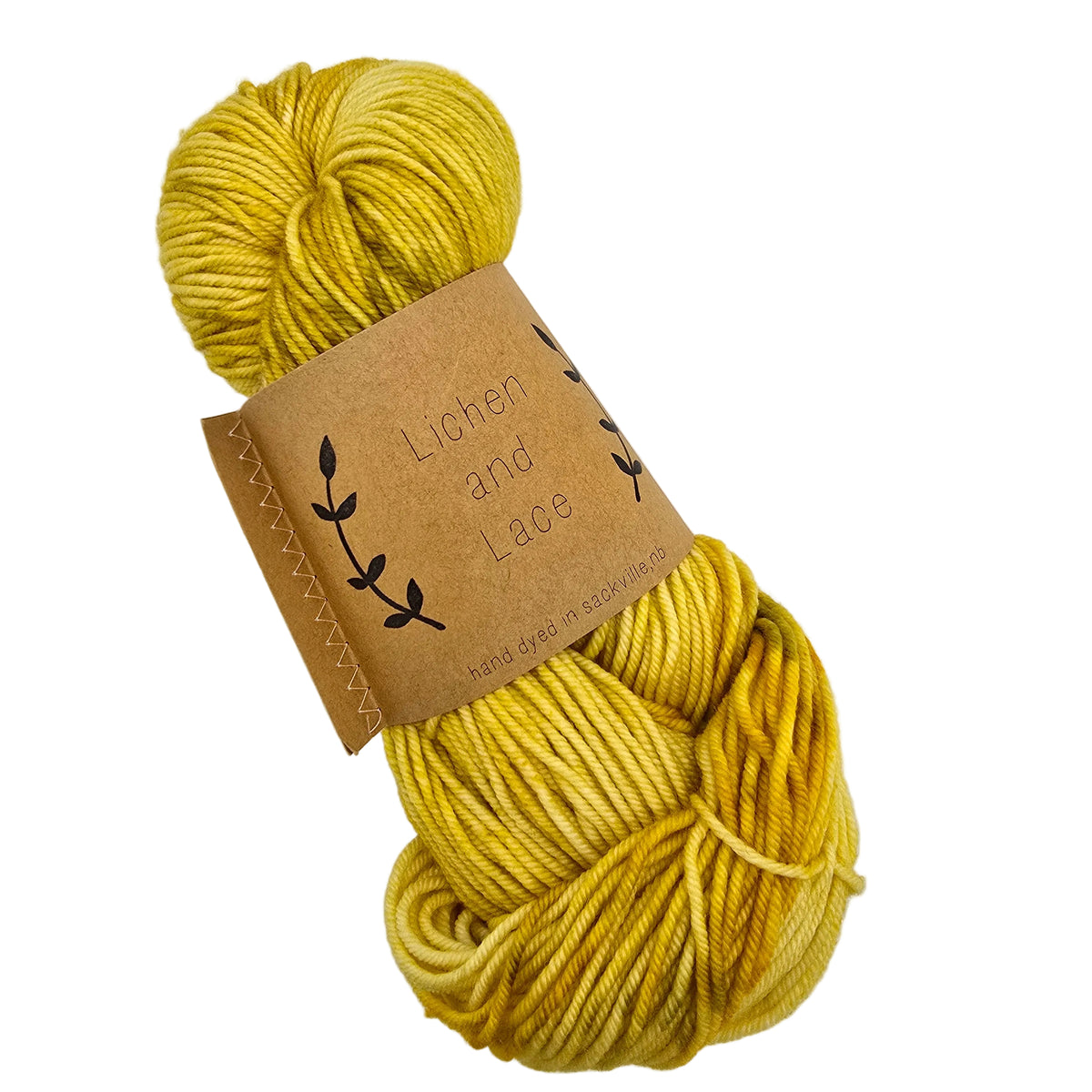 A skein of Superwash_Merno_Worsted_Yarn_by_Lichen_and_Lace in the color Dandelion_Dream mustard yellow yarn wrapped in a brown paper label on a white background.