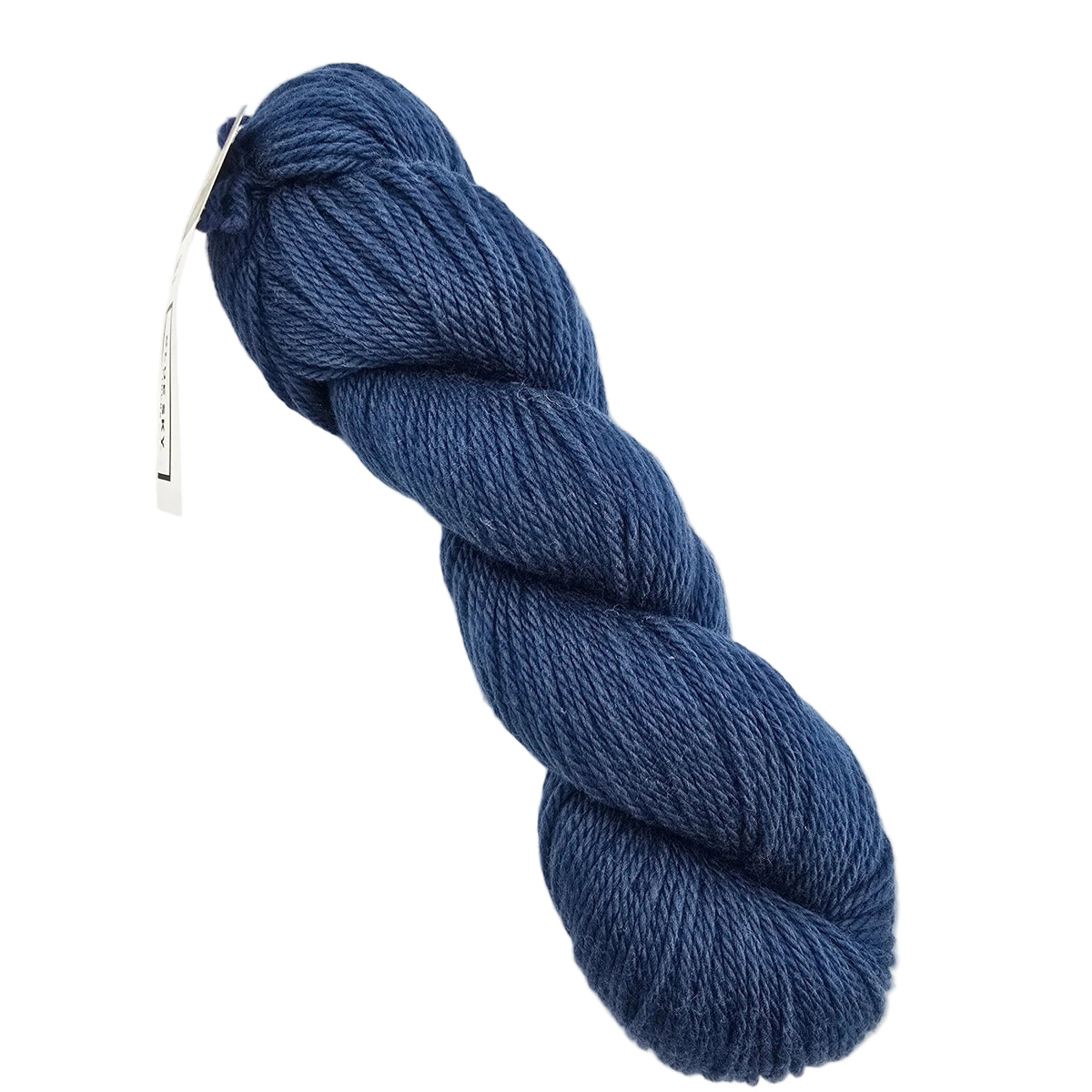 A skein of Sweater Worsted Yarn by Blue Sky Fibers in the color Lake a royal blue yarn with a paper label attached, photographed on a clean white background.