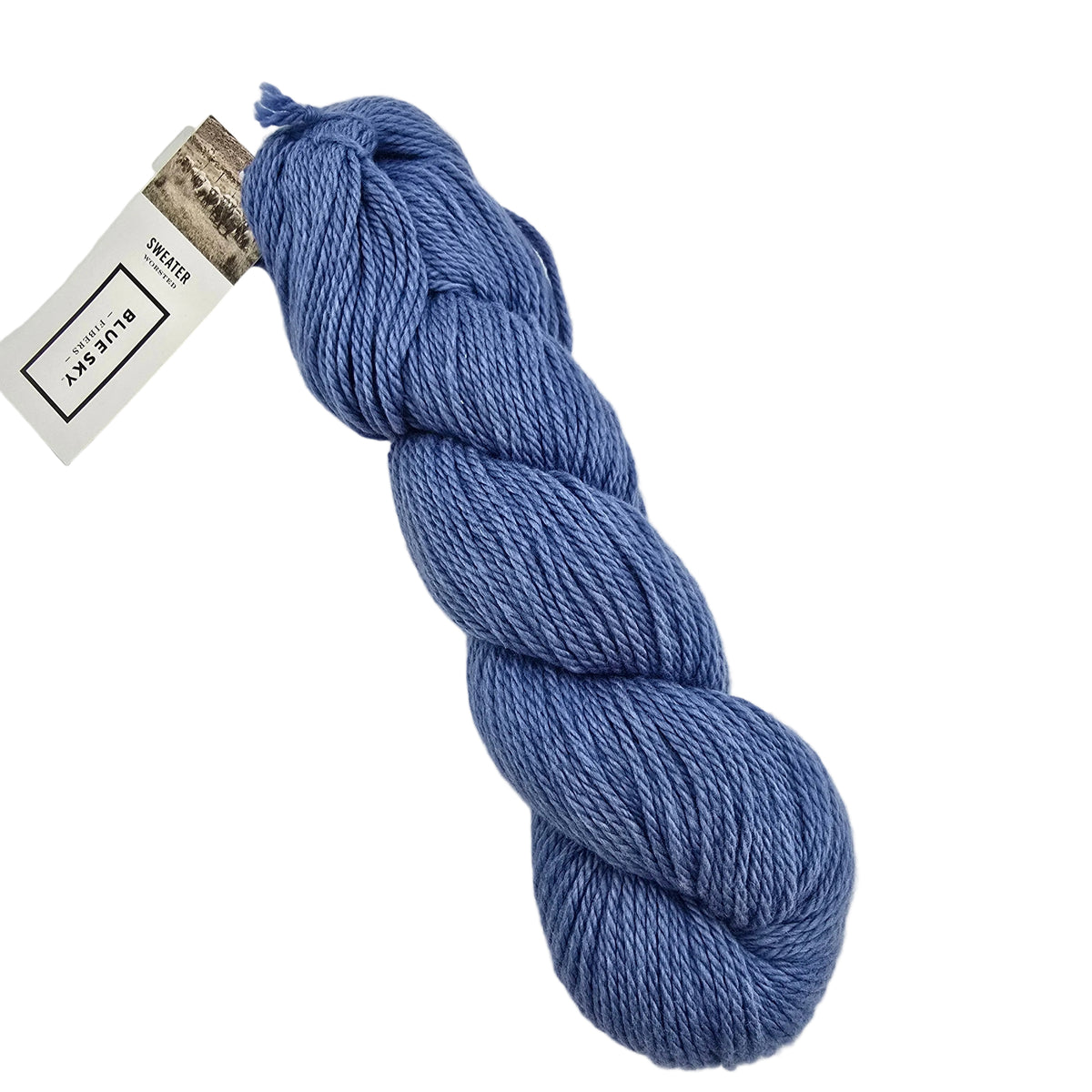 A skein of Sweater Worsted Yarn by Blue Sky Fibers in the color Skydiver a Periwinkle blue yarn with a paper label attached, photographed on a clean white background.