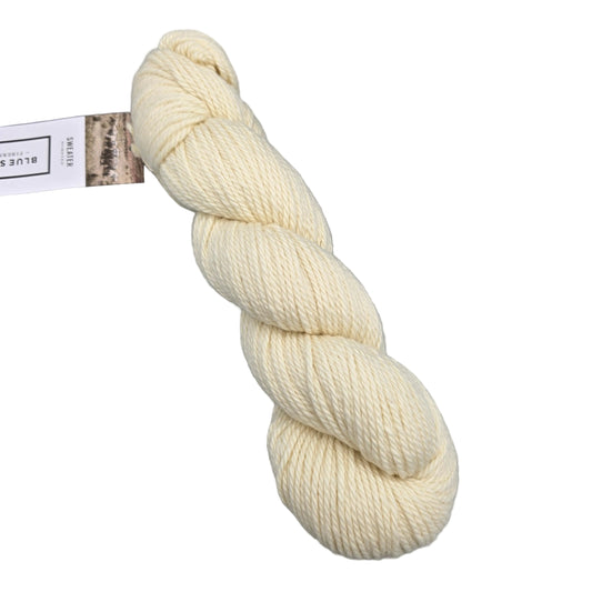 Image of a single skein of Sweater Worsted yarn by Blue sky in the color Ice Cream 7500 with label on a white background.