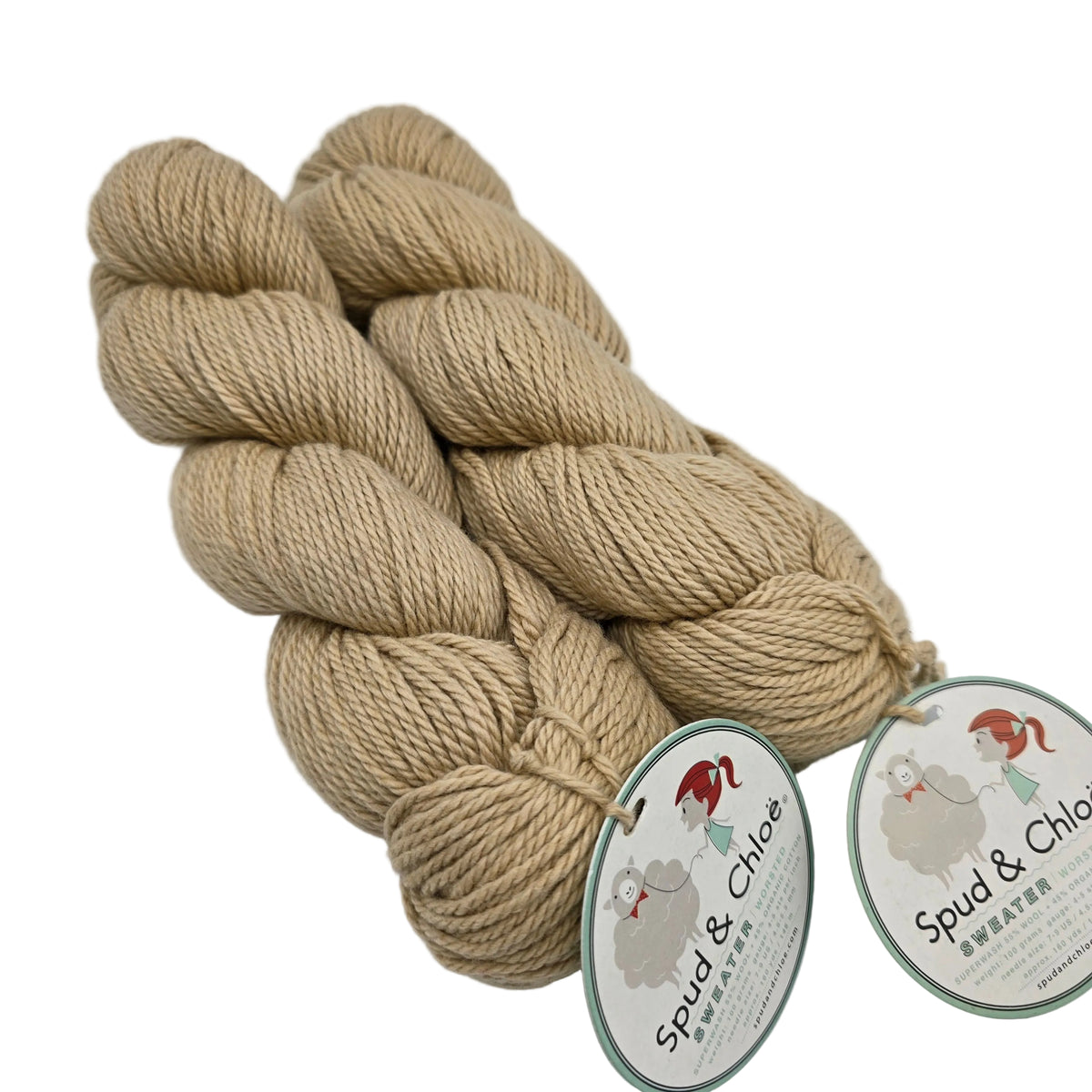 Three skeins of beige yarn with 'Spud & Chloe' labels on a white background
