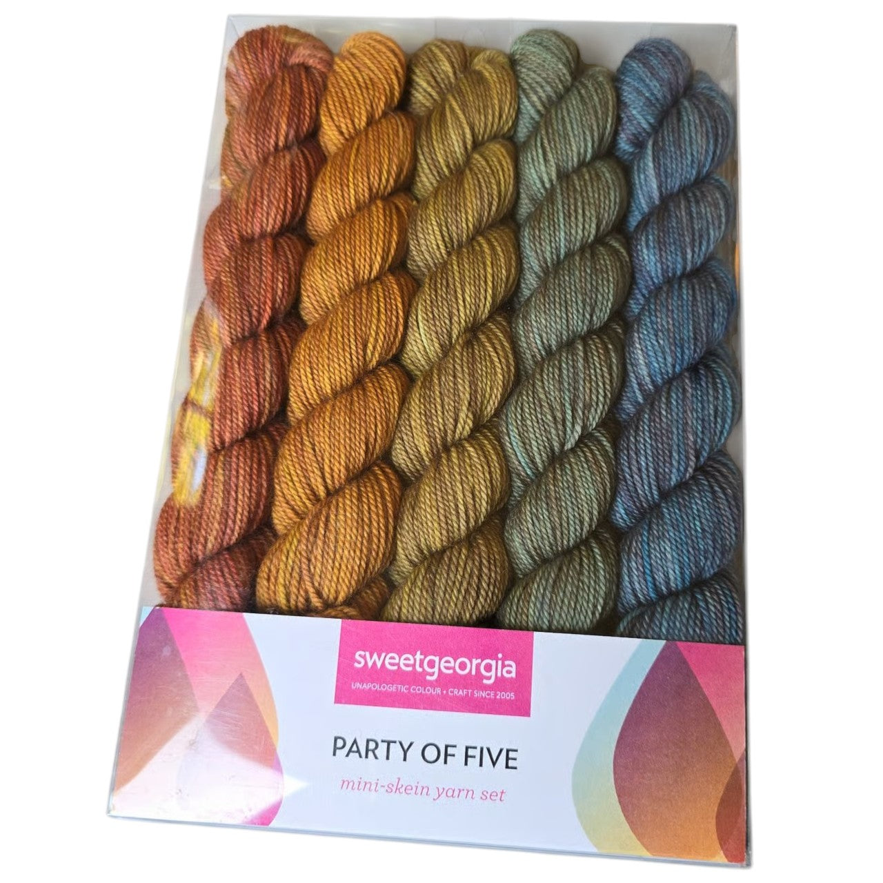 Image of a Sweetgeorgia brand  pack of 5 different colored mini skeins of yarn.  Colors include yellow,  oranges, green and  blue skein. Color is called Blazing trails by manufacturer, in a pink and white package on a white background.