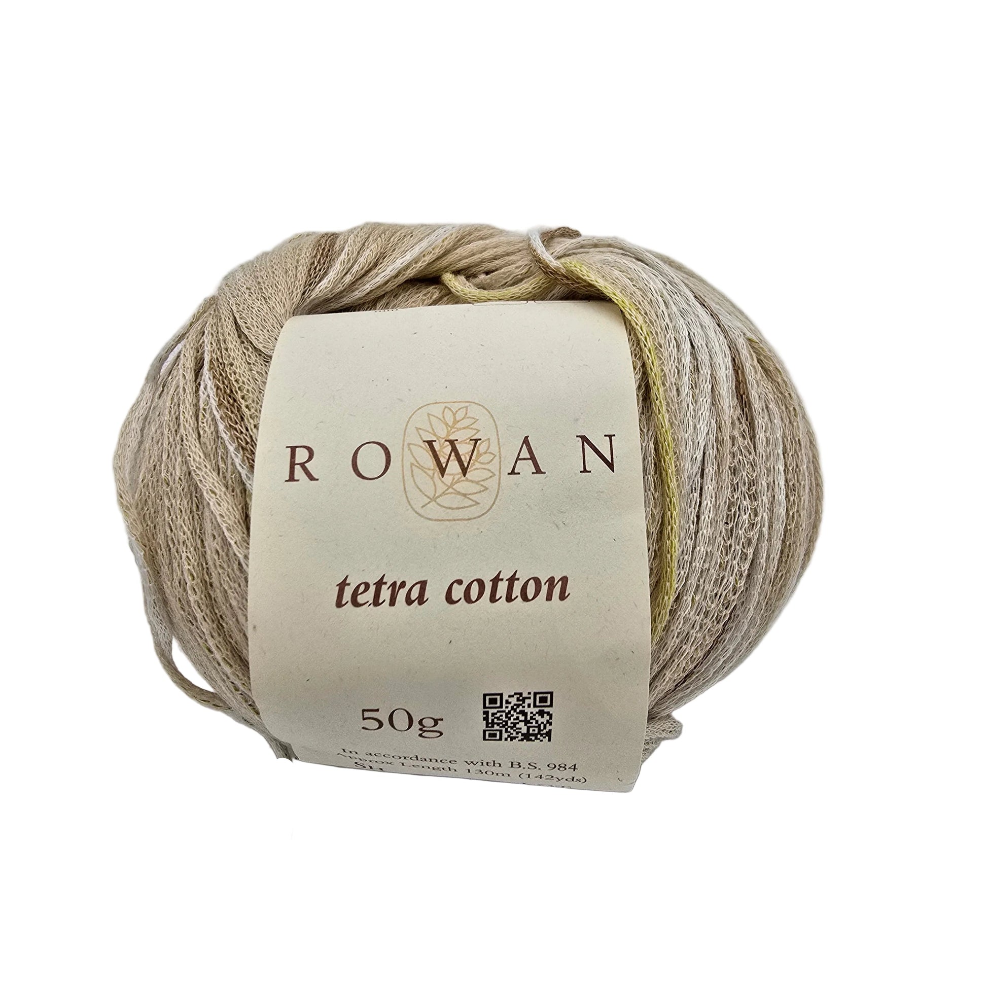 A ball of Rowan Tetra Cotton yarn in color 3  a light beige color, wrapped with a cream-colored paper label showing the brand name 'ROWAN' and product details, set against a plain light gray background.