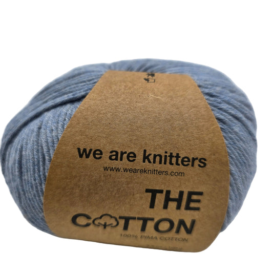Image of a single ball of The Cotton Yarn by We Are Knitters in Denim with label on a white background.