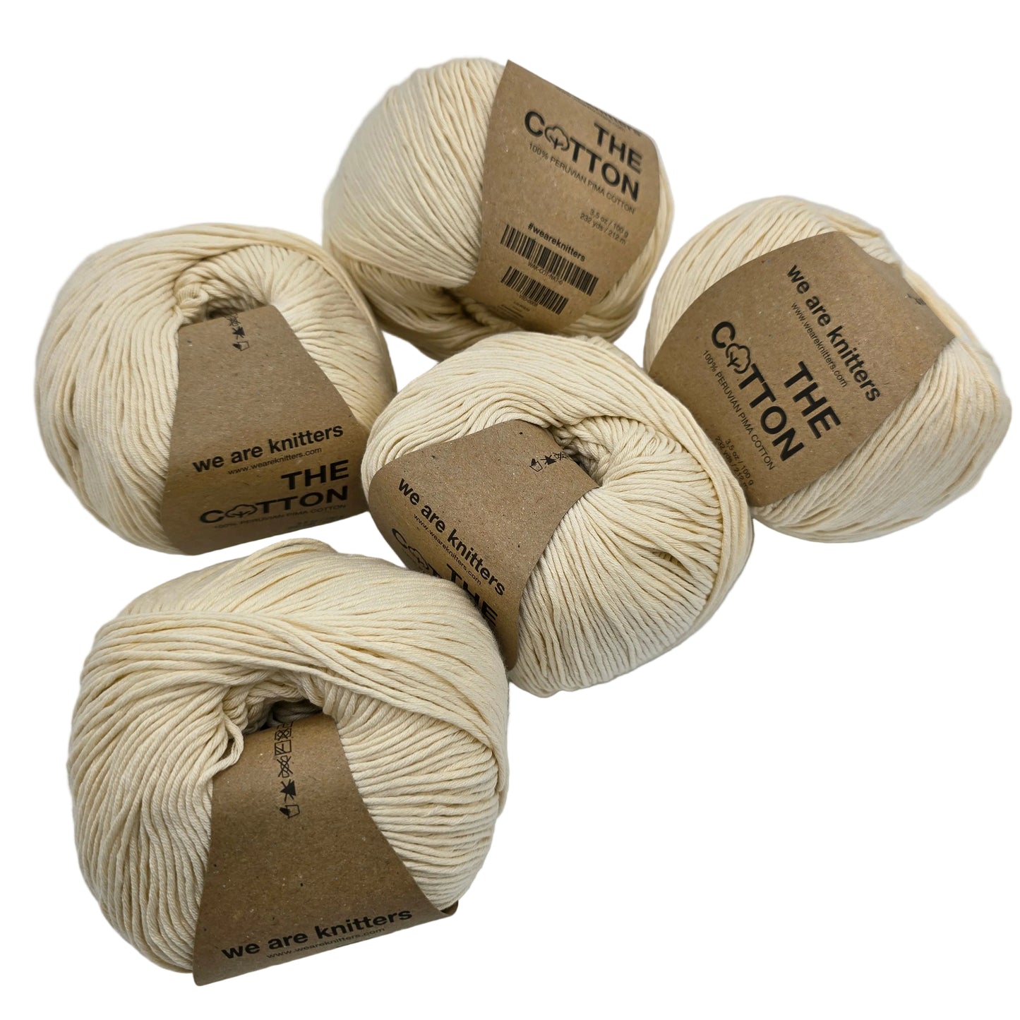 Image of multiple balls of The Cotton Yarn by We Are Knitters in Natural with labels on a white background.